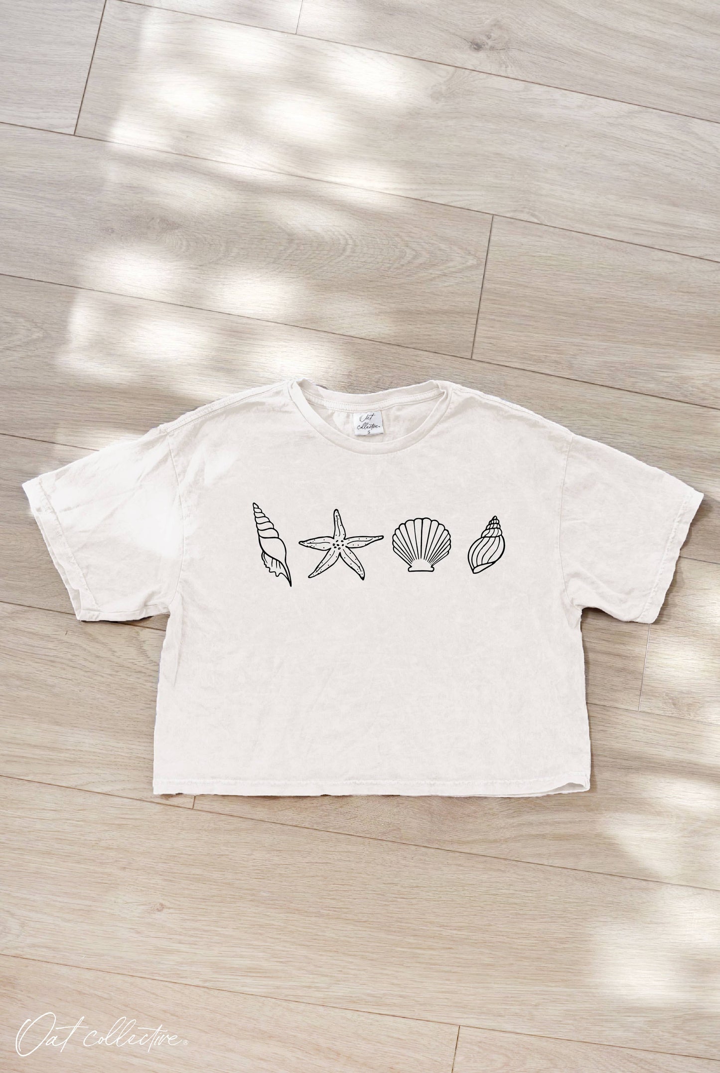 SEASHELLS ROW Cropped Mineral Washed Graphic Top